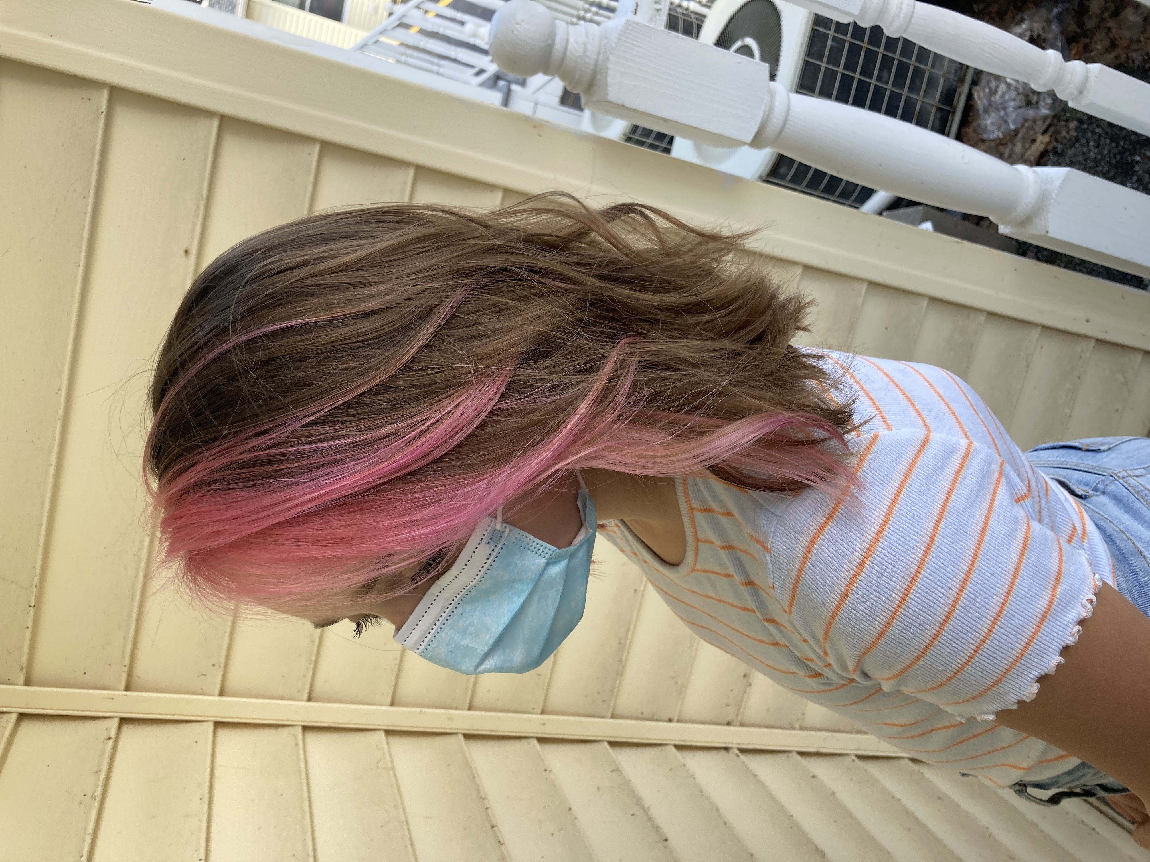 Child's color and style. Pink bangs.