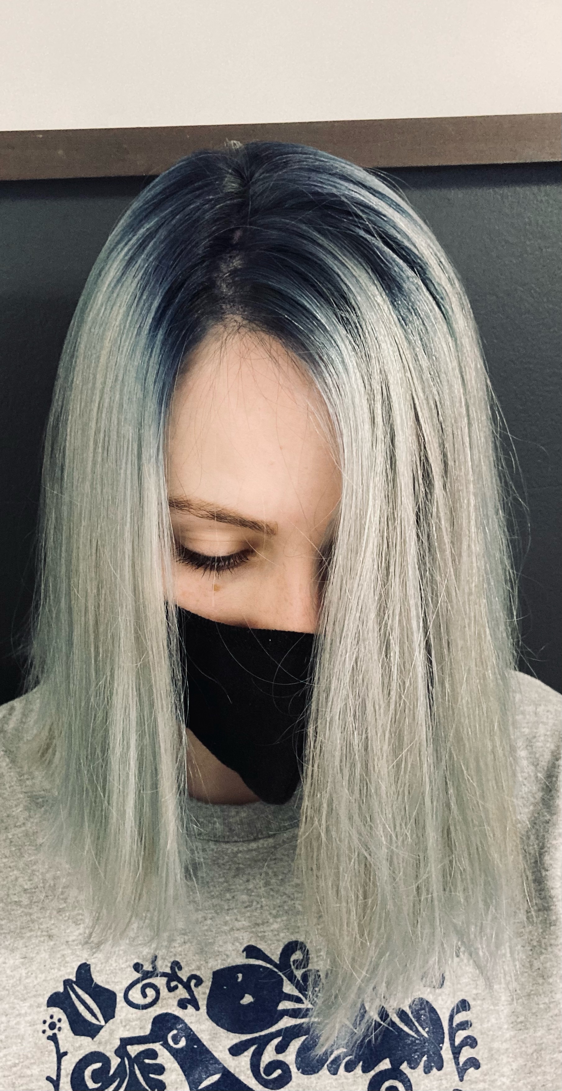 Dyed and styled gray with dark blue roots.