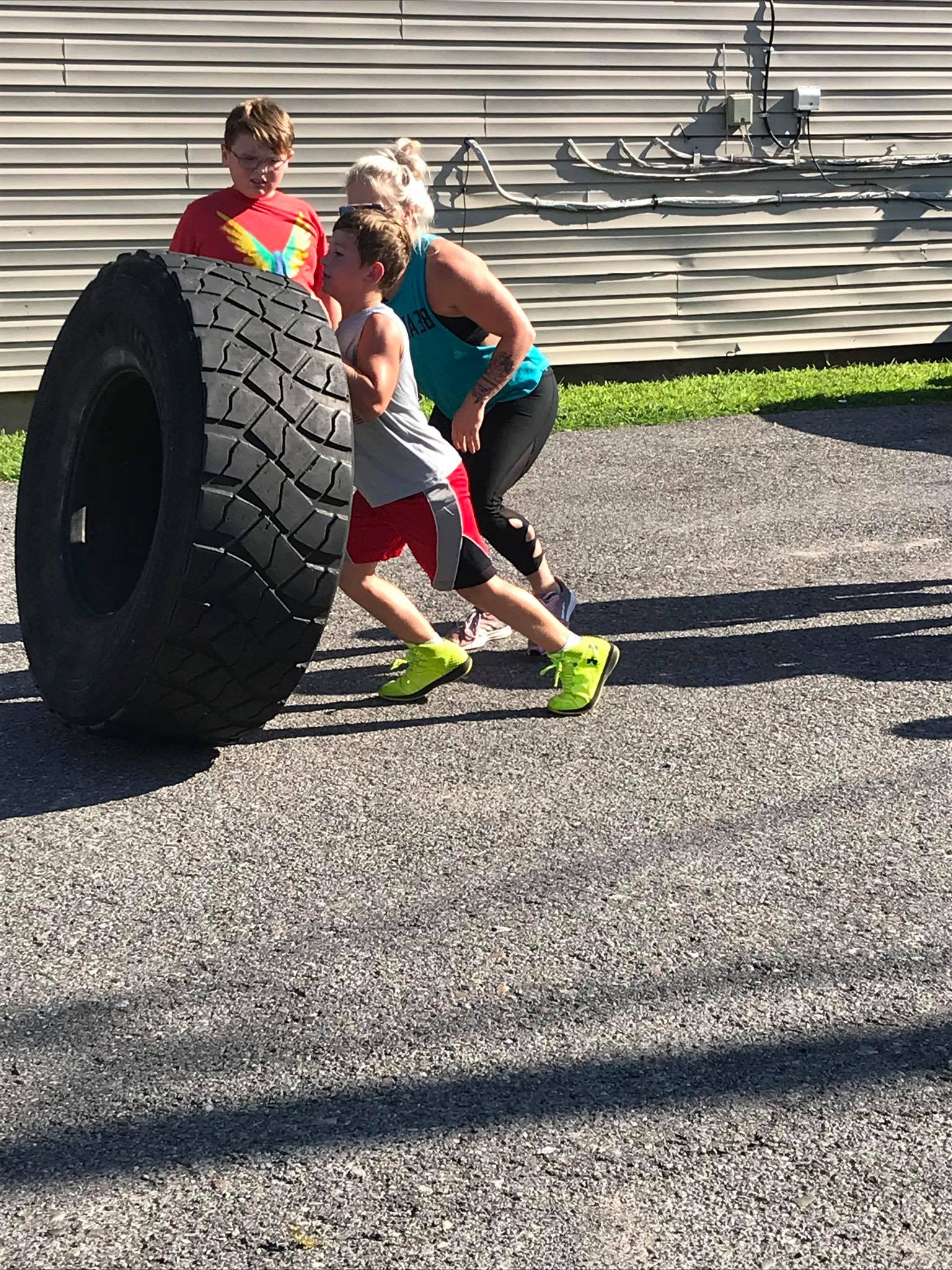 Kids lifting tire