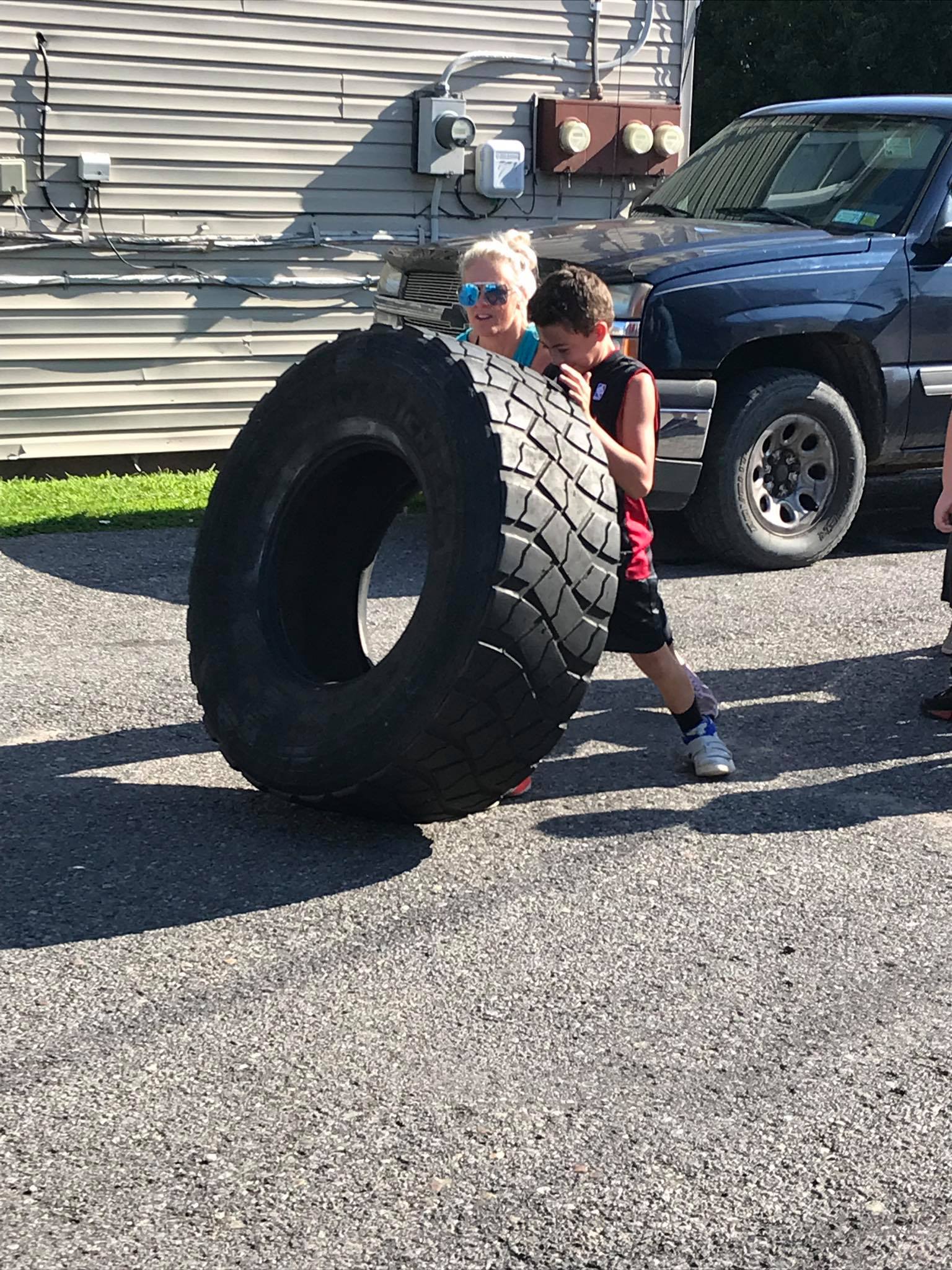 Kids lifting tire